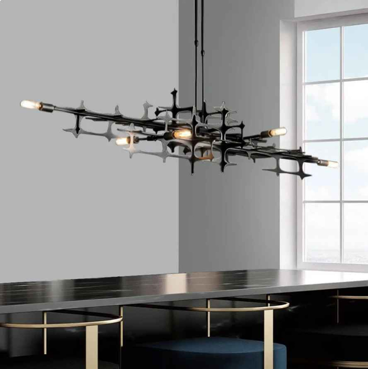 modern chandelier over dining table